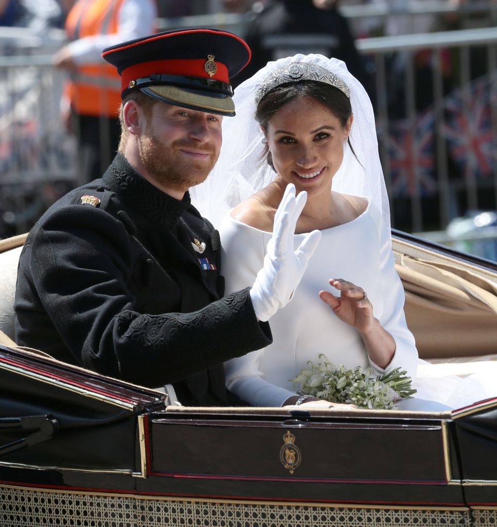 Prince Harry and Meghan Markle in their wedding carriage