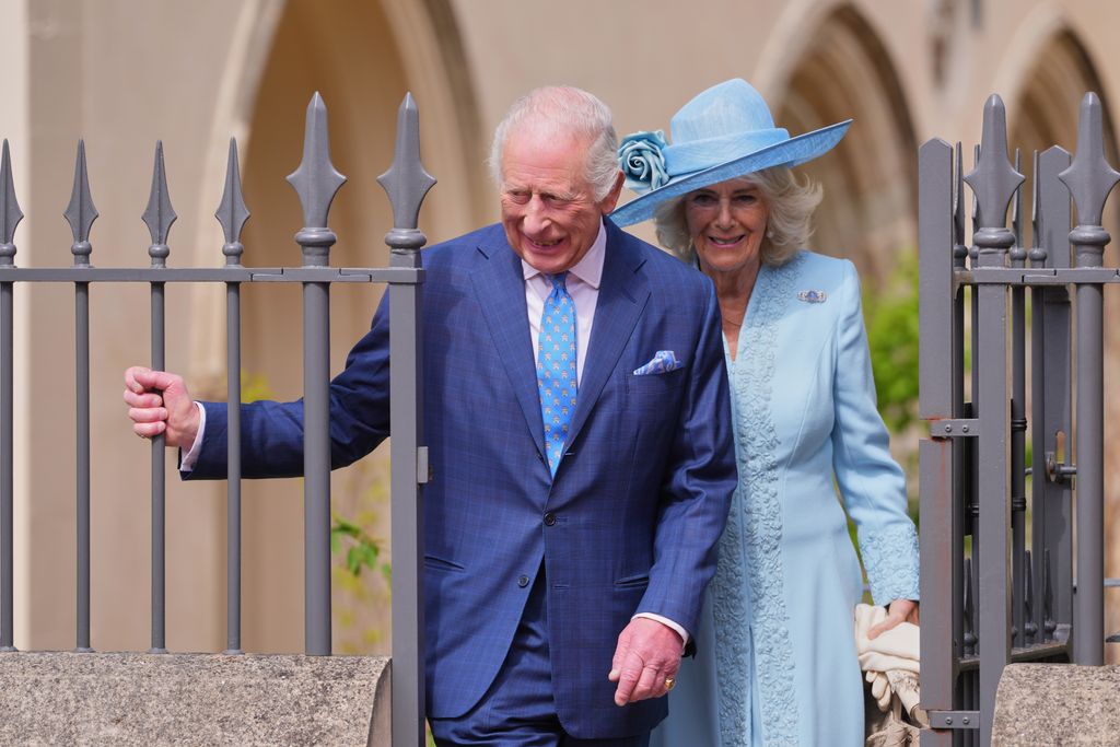 King and Queen smiling as they leave chapel