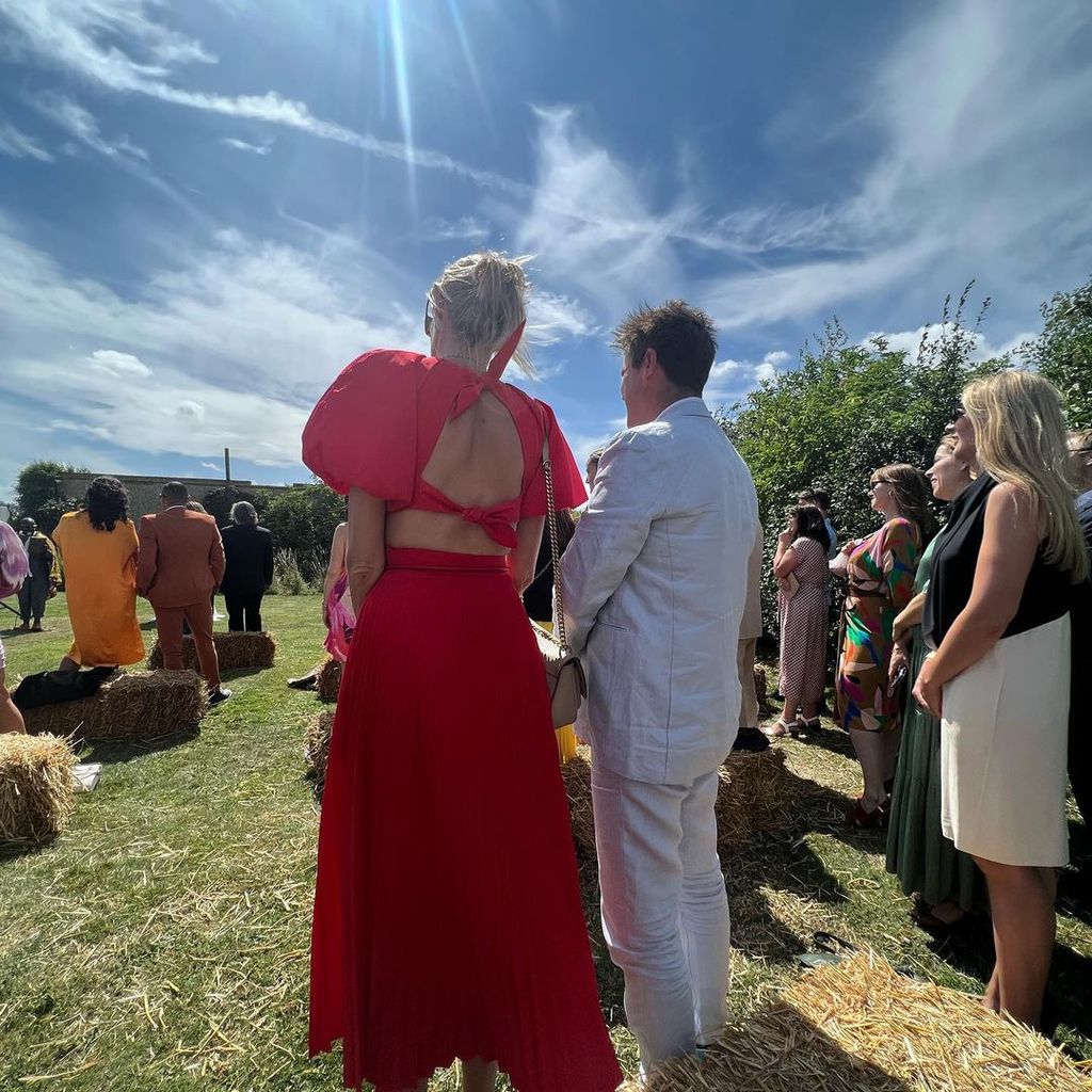 Zoe Ball showed off the back of her red wedding guest dress