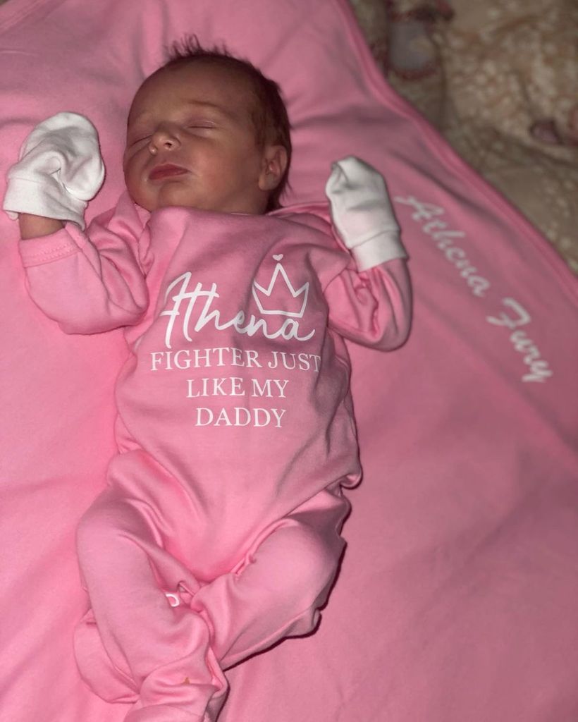 Paris and Tyson Fury's daughter Athena in a pink babygrow