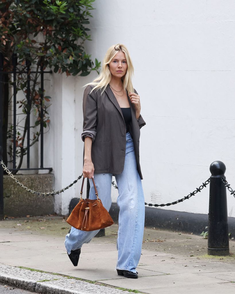 Sienna Miller walking through West London on May 29, 2024 in London, England. (Photo by Neil Mockford/WireImage)