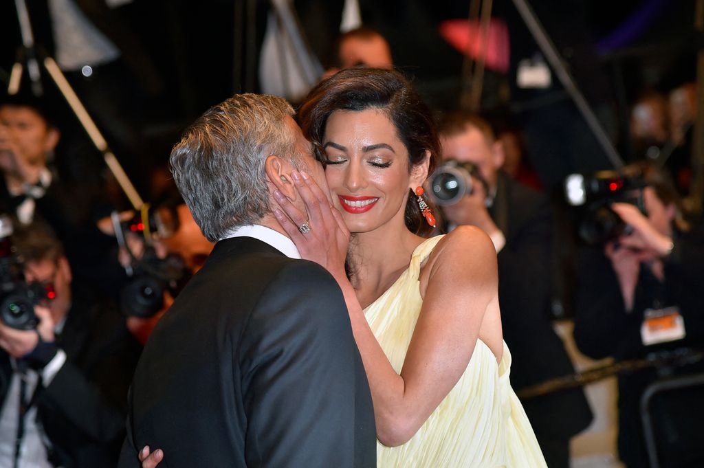 george kissing a smiling amal