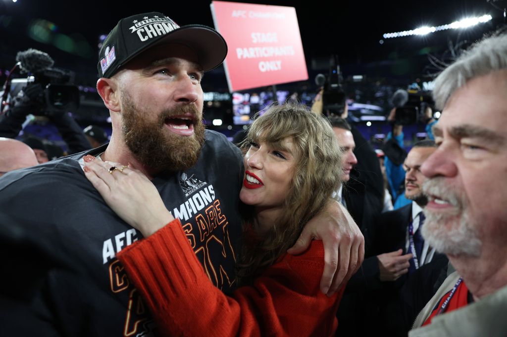 Travis Kelce #87 of the Kansas City Chiefs celebrates with Taylor Swift 