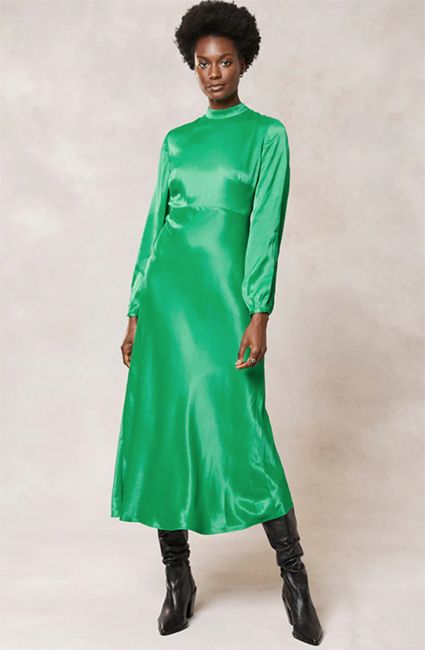 woman wearing long sleeve bright green satin midi dress 
