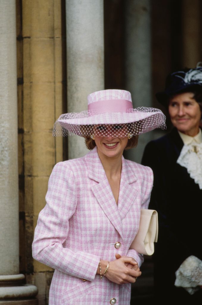 Diana in a netted hat with pink checked coat 