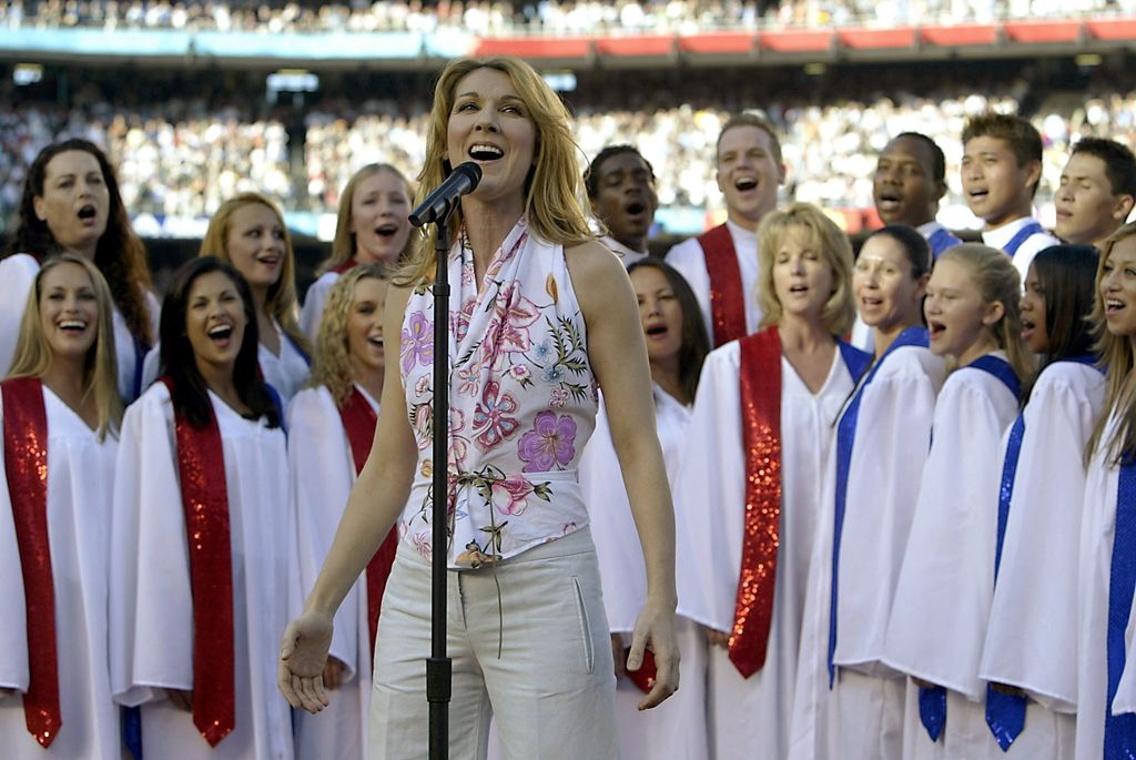 Celine Dion sings "God Bless America" before the start of Super Bowl XXXVII at Qualcomm Stadium 26 January, 2003 in San Diego, California. The Tampa Bay Buccaneers will play the Oakland Raiders for the NFL championship.