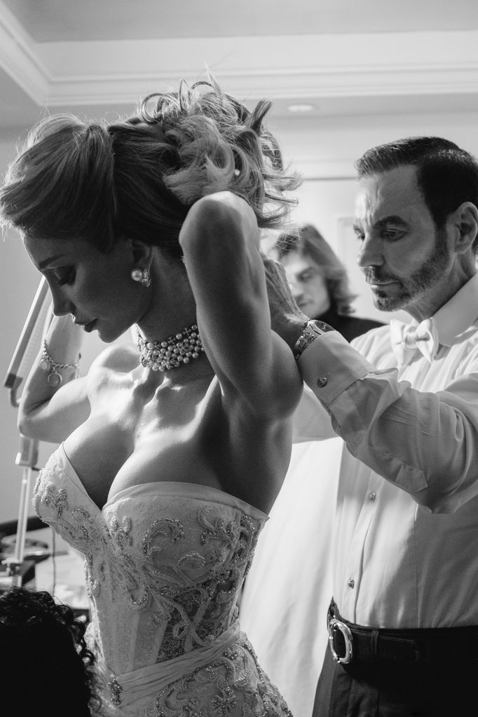 Richard GOnzalez and Sarah Rollins' wedding as he helps her into second dress