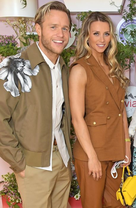Olly Murs and his fiancee Amelia Tank in brown outfits