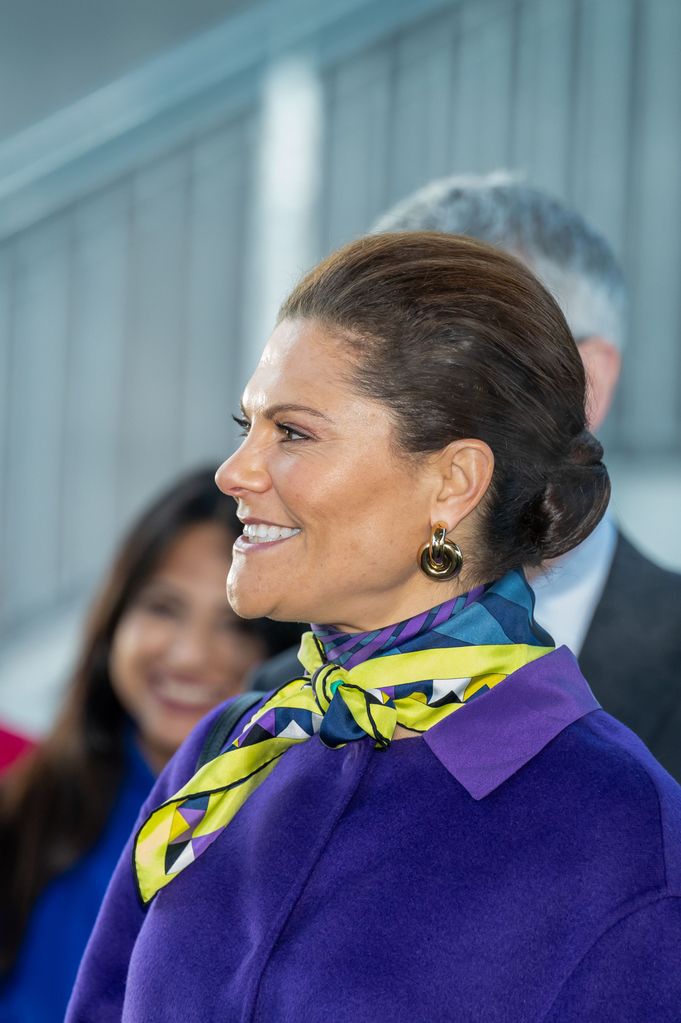 Crown Princess Victoria in purple coat and patterned scarf