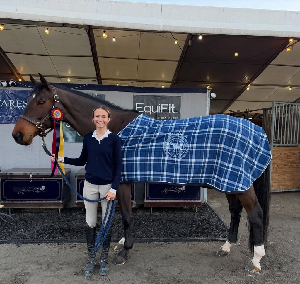 Grace Wahlberg posing with her horse Tippy Z after winning a ribbon, shared on Instagram