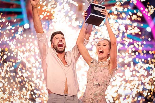 Giovanni Pernice and Rose Ayling Ellis lifting a trophy
