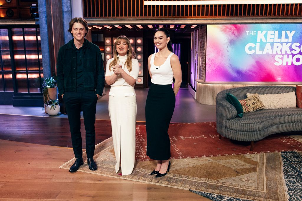 Kelly in white hosting Christopher Briney and Lily James