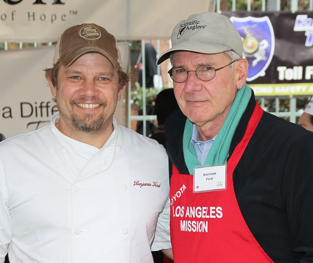 Chef Ben Ford (L) and father actor Harrison Ford attend the Los Angeles Mission's Christmas Eve for the homeless at the Los Angeles Mission on December 24, 2012 in Los Angeles, California