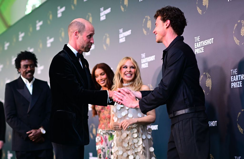 Shawn thanked Prince William for his kindness when he asked about the singer's mother, Karen. "She’s still shaking, thank you," Shawn told the royal, who had also surprised Karen with a cake after hearing it was her birthday on Sunday. 
 