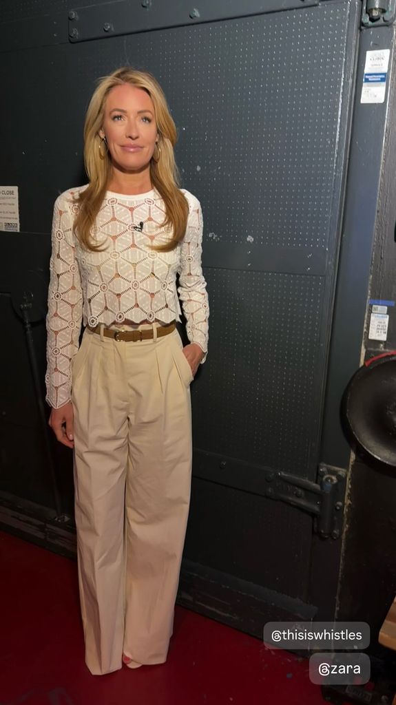Cat deeley wearing white top and cream trousers on This Morning