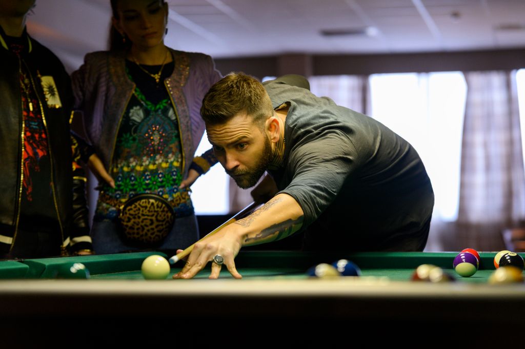 Alessandro Borghi playing billiards in a still image from Suburra: Blood on Rome