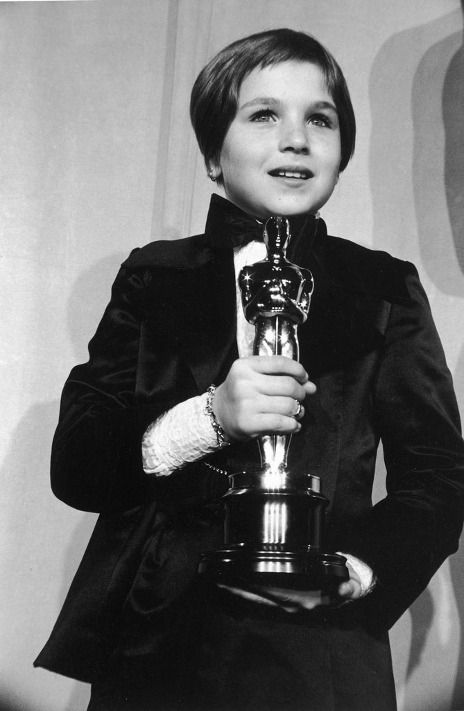 Tatum O'Neal, wearing a tuxedo, holds her Oscar for Best Supporting Actress for her role in director Peter Bogdanovich's film, 'Paper Moon,' at the 46th Annual Academy Awards, Dorothy Chandler Pavilion, Los Angeles, California. She was the youngest actor 