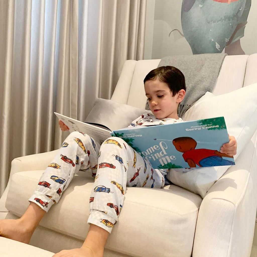 Eric reading a book in PJs