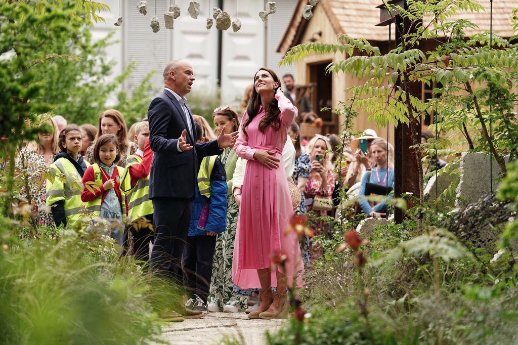 Kate Middleton looks up during a tour of one of the Chelsea Flower Show gardens