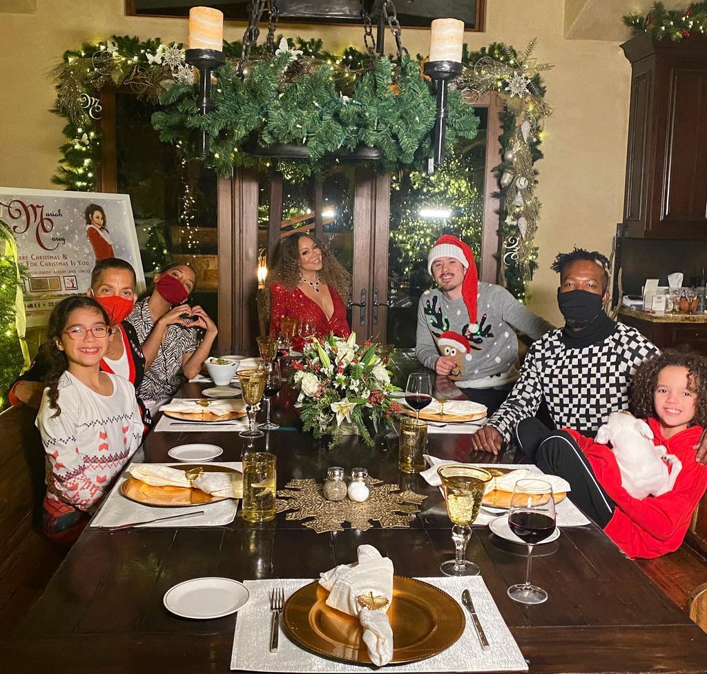 Mariah Carey with her family having dinner in the dining room. 