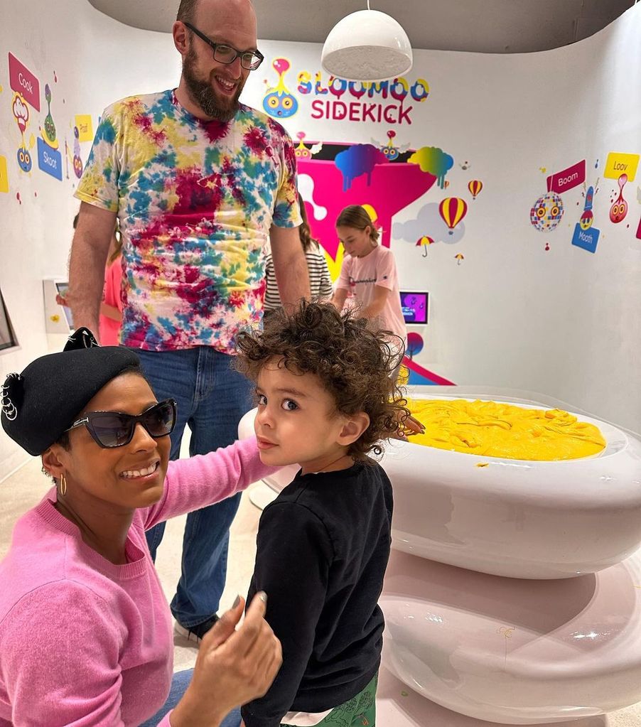 Tamron Hall with her son and husband 