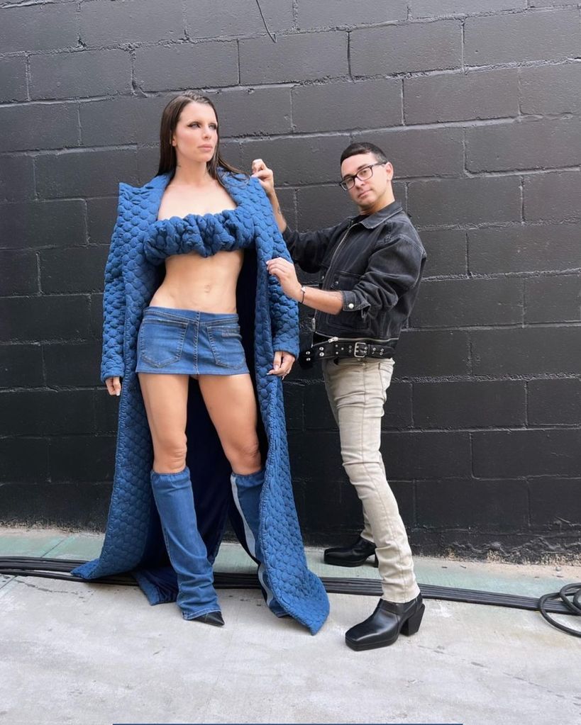 Christian stood next to Julia Fox fitting her denim look