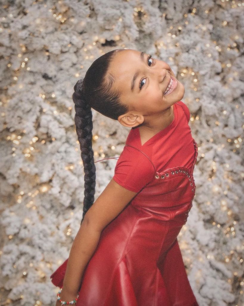 Chicago rocked a red dress with matching red leather cowboy boots