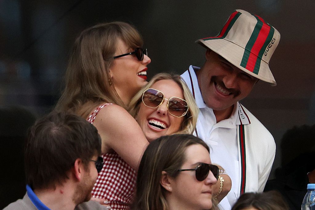 Taylor Swift, Travis Kelce of the Kansas City Chiefs and Brittany Mahomes attend the Men's Singles Final match between Taylor Fritz of the United States and Jannik Sinner 