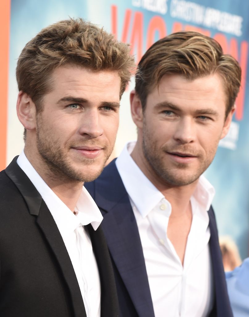 Liam and Chris Hemsworth at a movie premiere