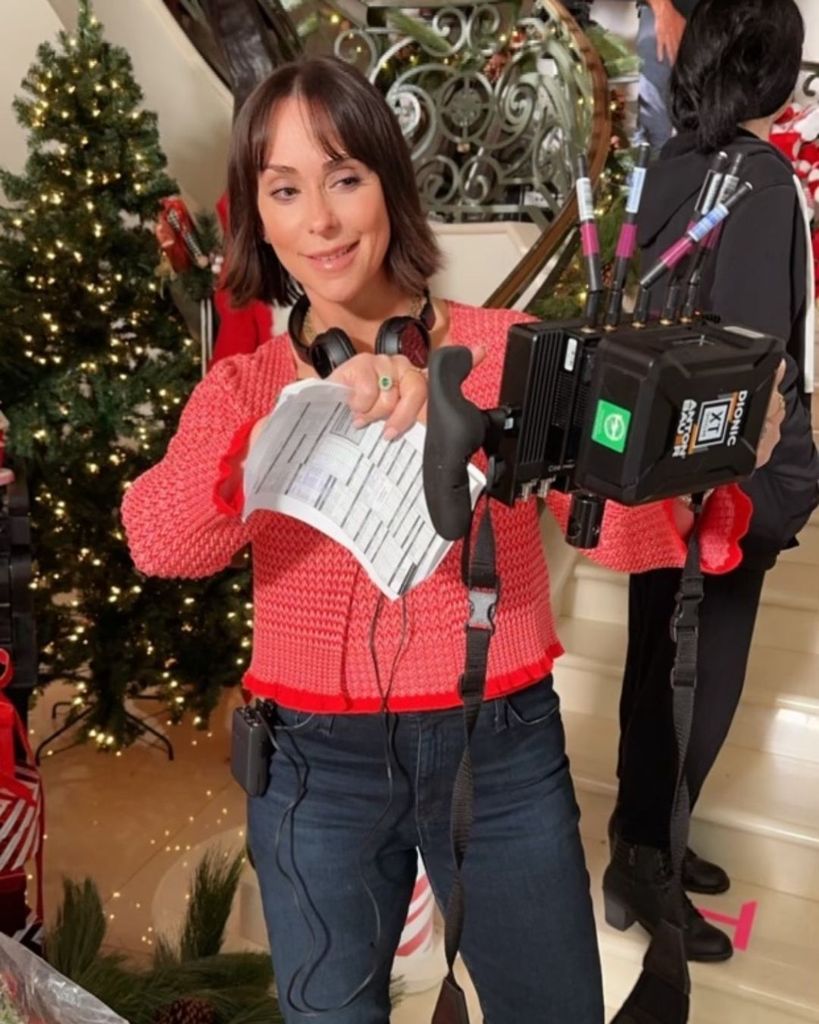 Jennifer Love Hewitt pictured behind the scenes of Lifetime Christmas movie