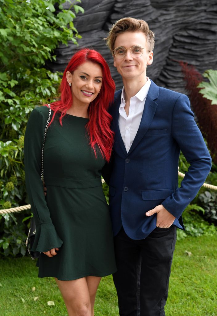 Dianne Buswell in a green dress and Joe Sugg in a blue suit