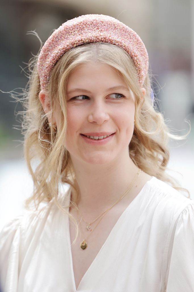 Lady Louise Windsor in a white dress and pink hairband