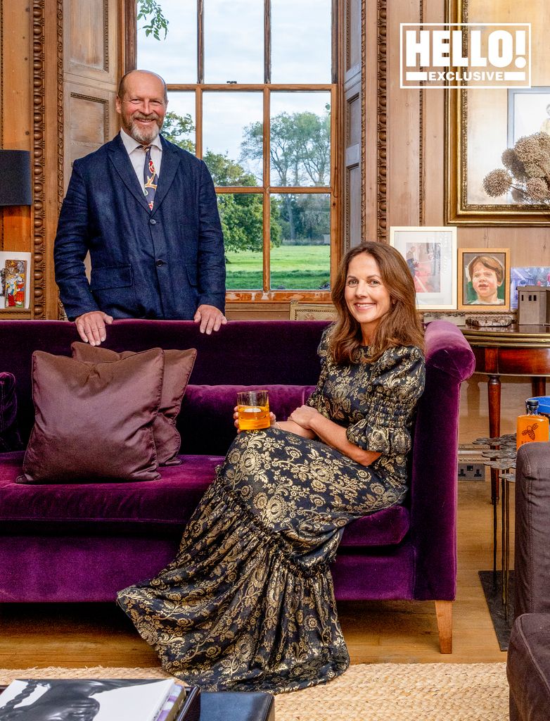 Nicola and James Reed posing on sofa at Wiltshire home 