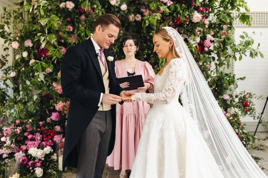 Alice Liveing exchanging rings with her husband Paddy