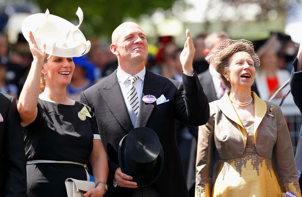 couple waving at royal ascot