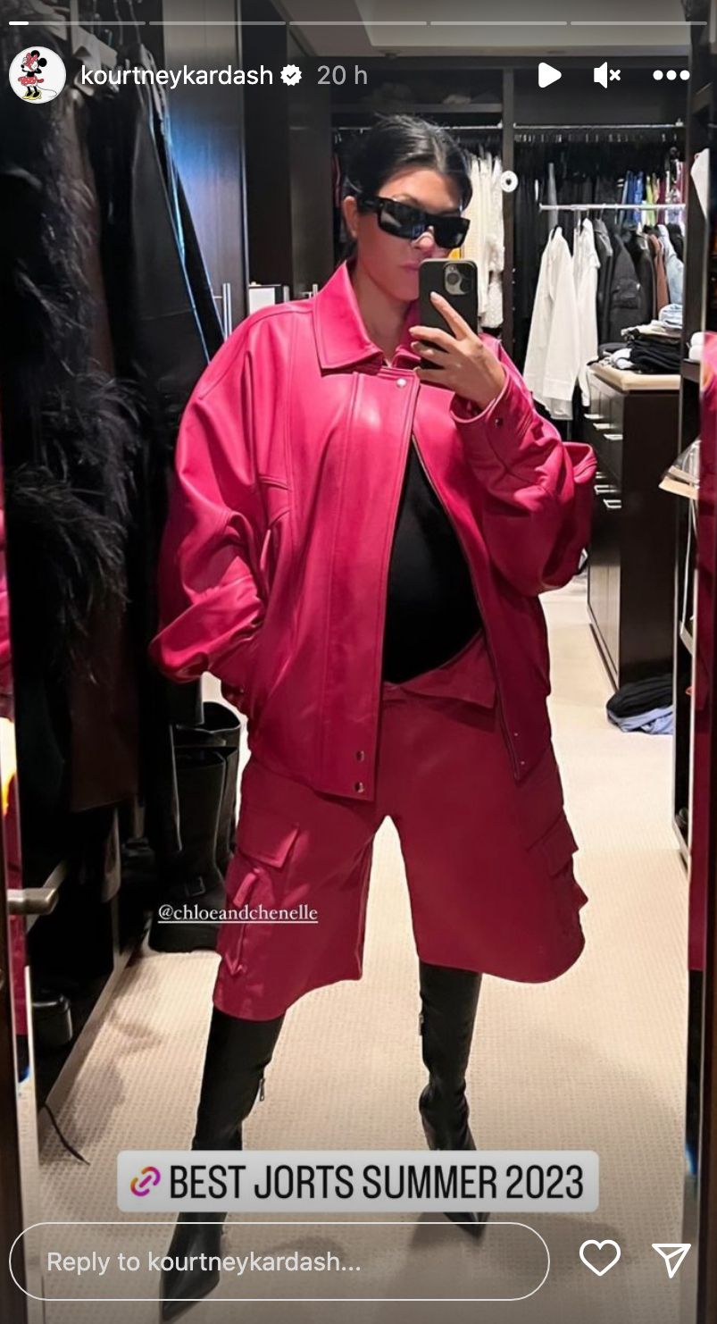 Kourtney Kardashian poses in pink co-ord 