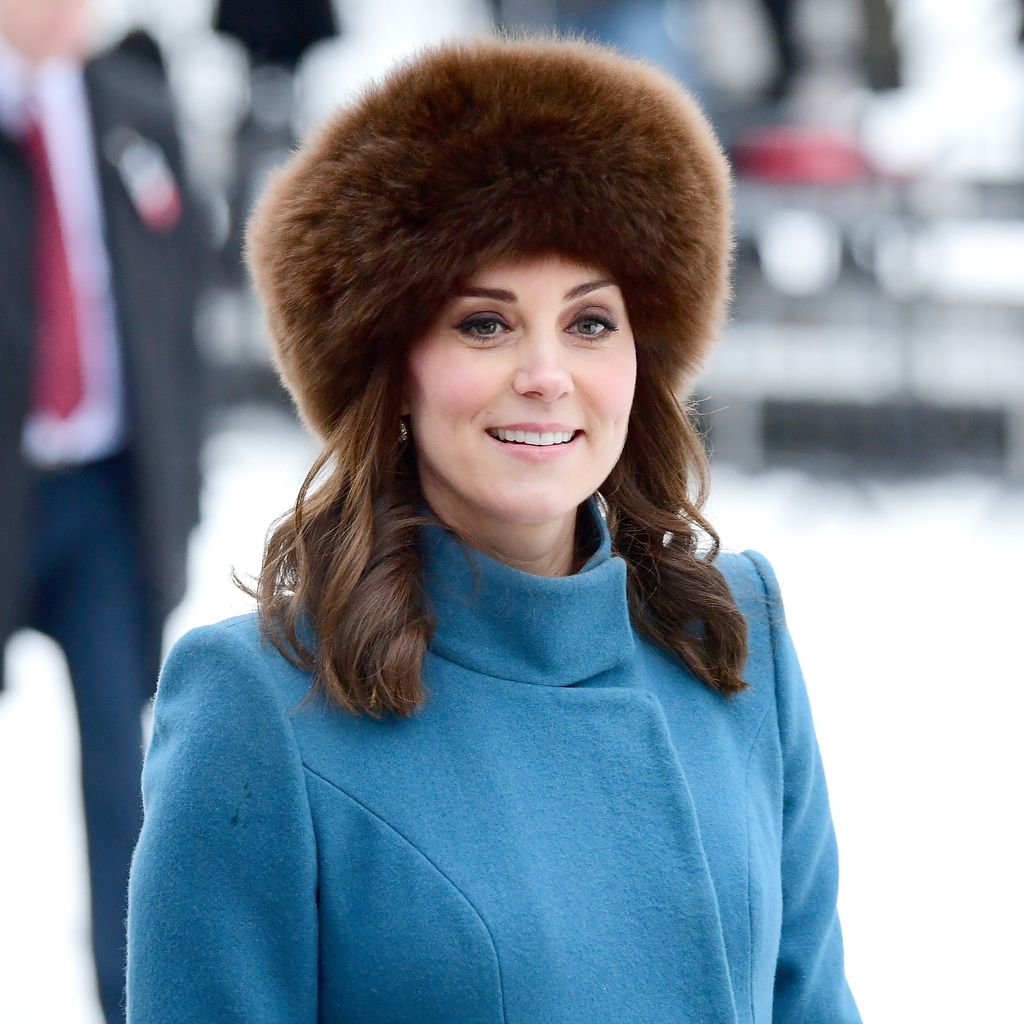 Kate Middleton wearing a brown fluffy hat 