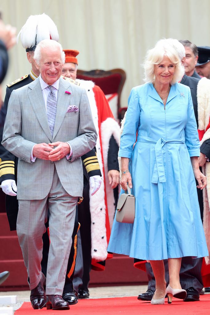 Charles and Camilla smile in Jersey