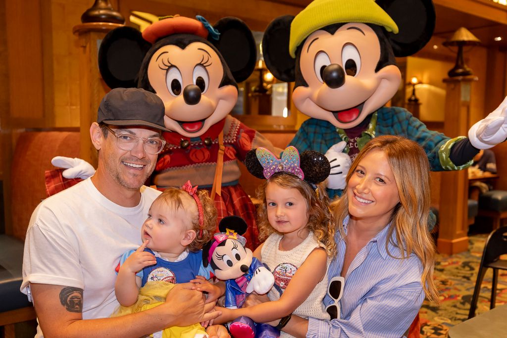 photo of ashley tisdale and family at disneyland