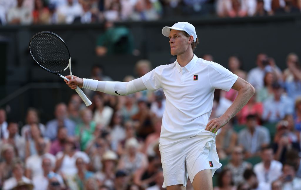 Jannik Sinner of Italy celebrates winning match point against Novak Djokovic of Serbia during the Gentlemen's Singles semi-final match on day twelve of The Championships Wimbledon 2025 