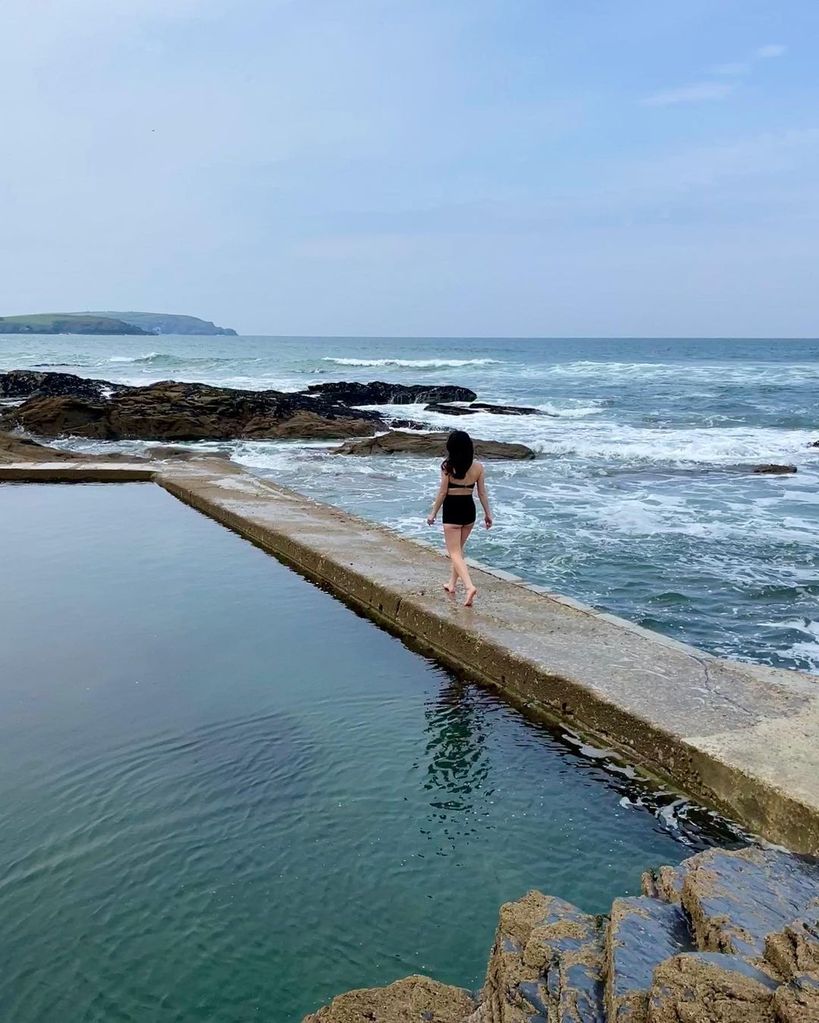 young woman swimming in tidal pools