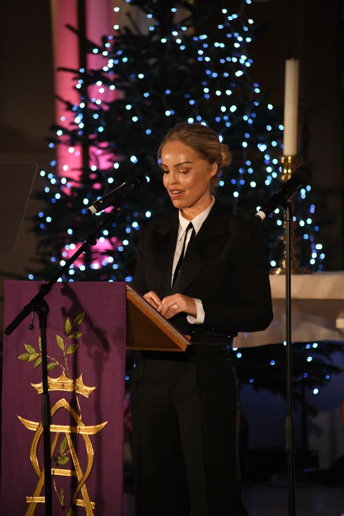 Katie Piper speaking to guests at St Peter's Church in London