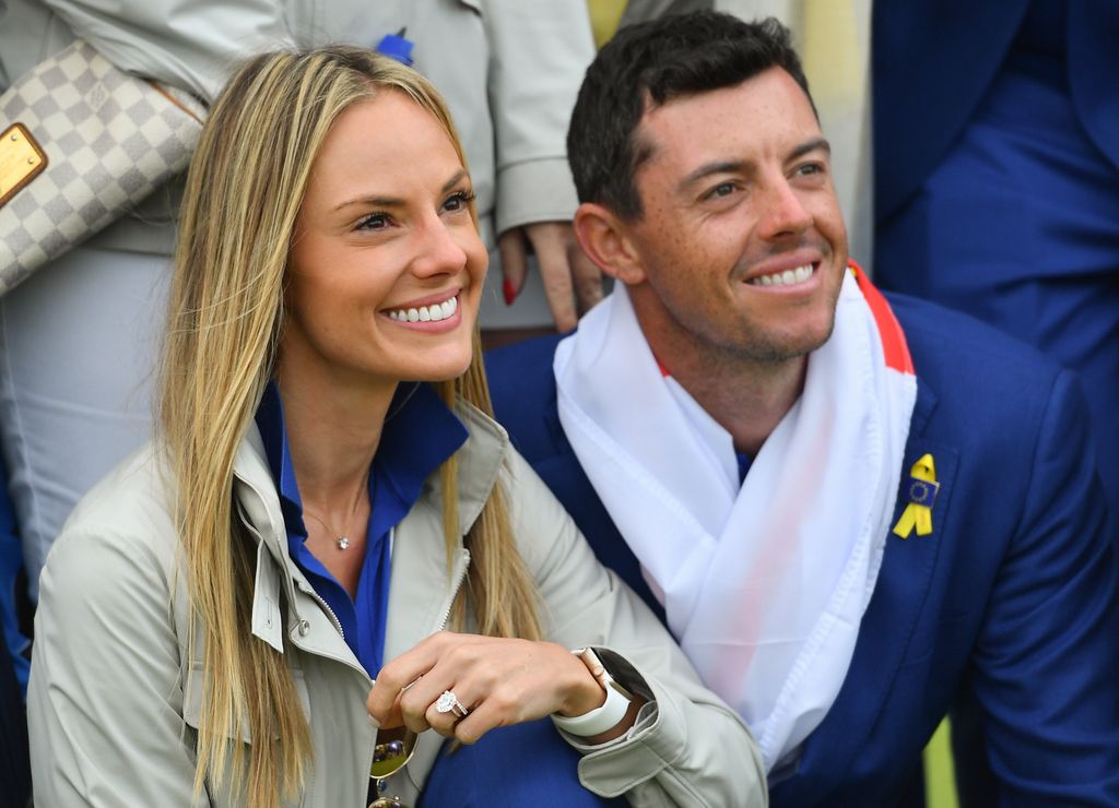 Erica Stoll and Rory McIlroy kneeling together