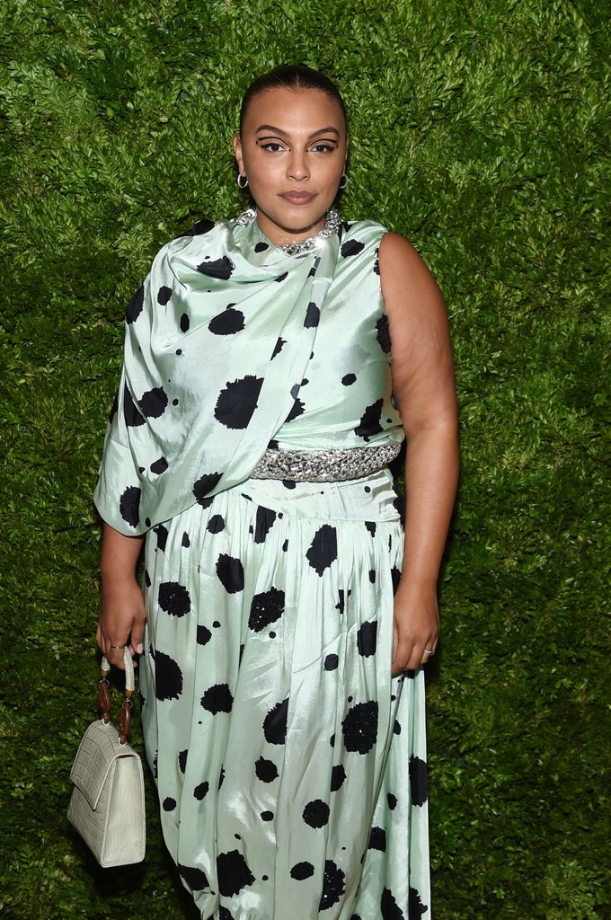 Paloma Elsesser wears a mint green satin gown with black polka dots and a crystal belt at a 2019 CFDA event.