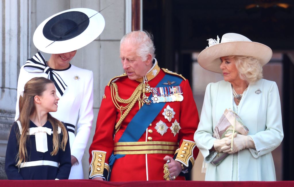 Princess Charlotte talking to King Charles on palace balcony