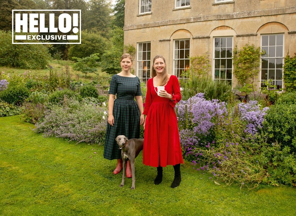 Sophie and Coco Conran posing in garden of family home with dog