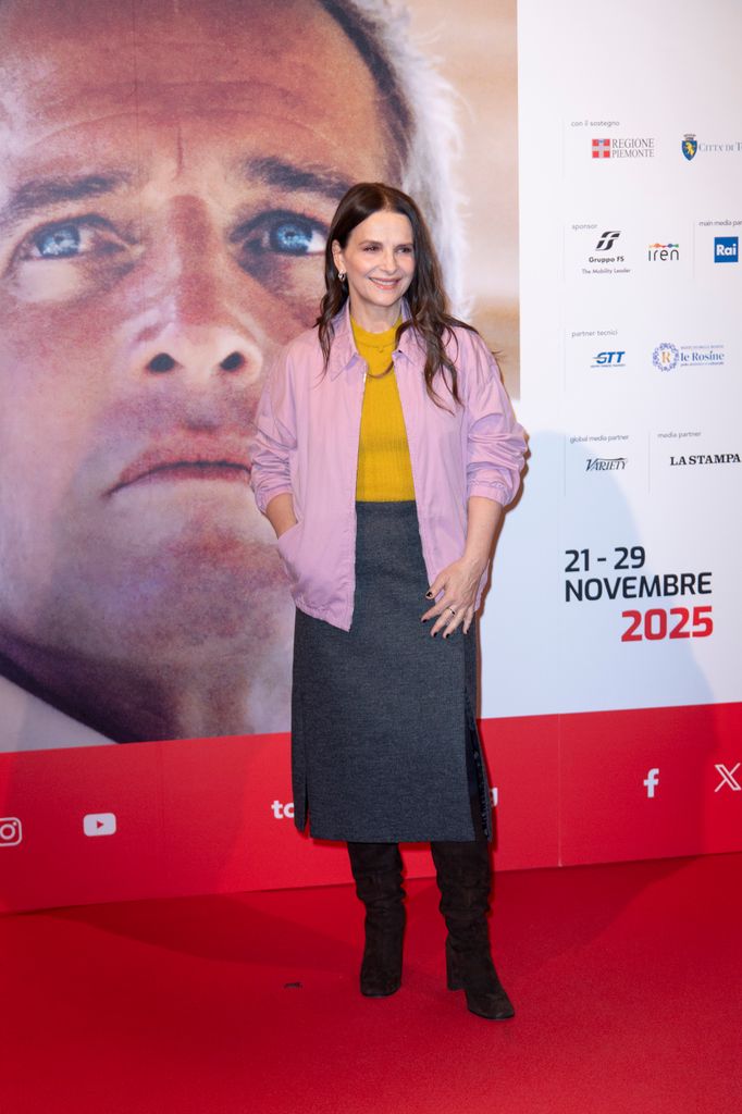 Juliette Binoche in Prada outfit to the photocall during the 43rd Torino Film Festival 2025 
