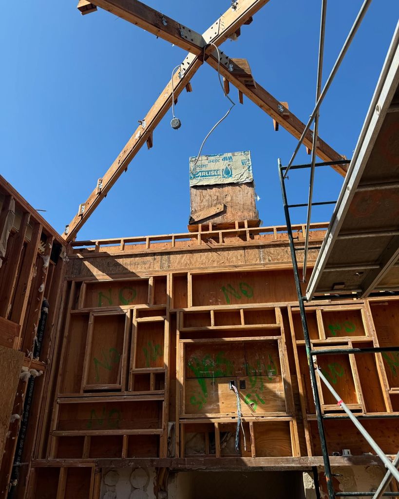 photo of construction works against blue sky