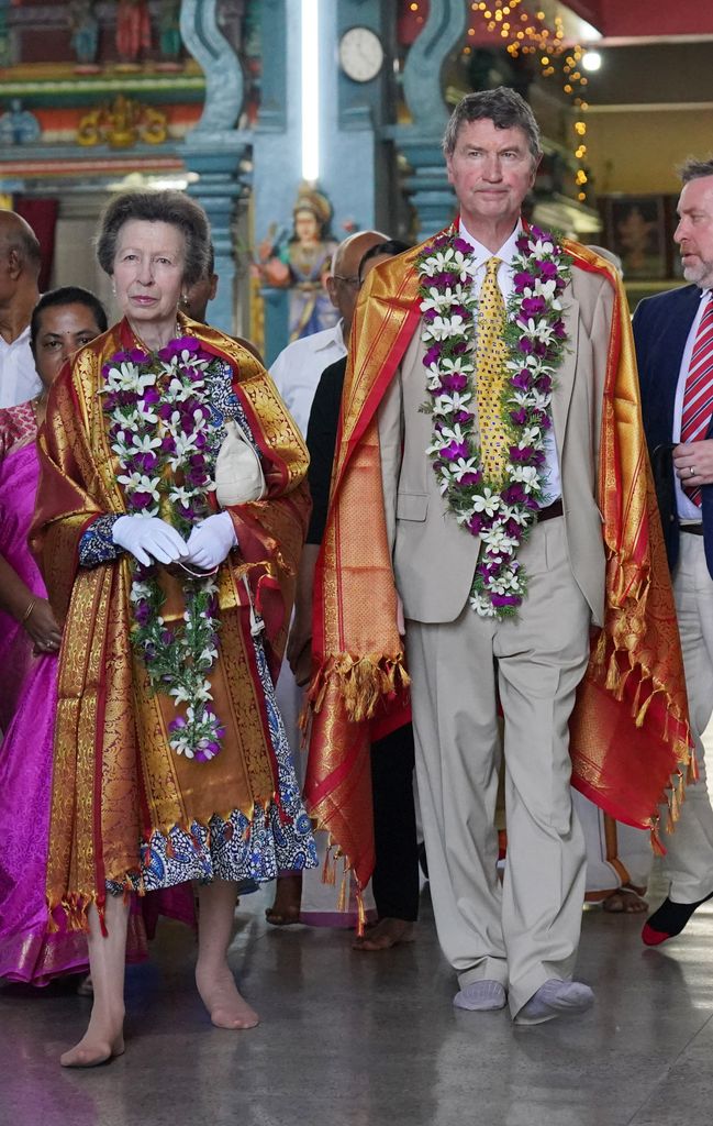 A shimmering scarf of gold and red silk was draped over the princess and her husband’s shoulders, a garland of jasmine and rose flowers were placed around their necks and each received a pottu in the middle of their forehead