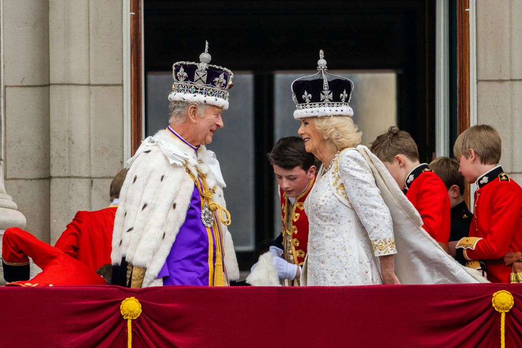 King Charles and Queen Camilla look at each other